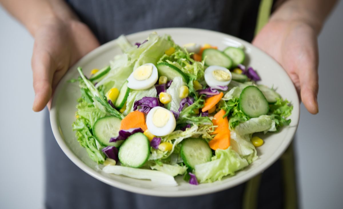A fresh vegetable salad plate with cucumber and carrots
